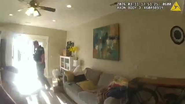A second officer&rsquo;s body camera shows Lt. Adamson standing in the doorway with a phone to his ear at 5:51:25 PM