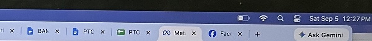 The top right corner of the laptop screen in the St. Petersburg store photograph, enlarged: the menu bar clock reads Sat Sep 5 12:27 PM
