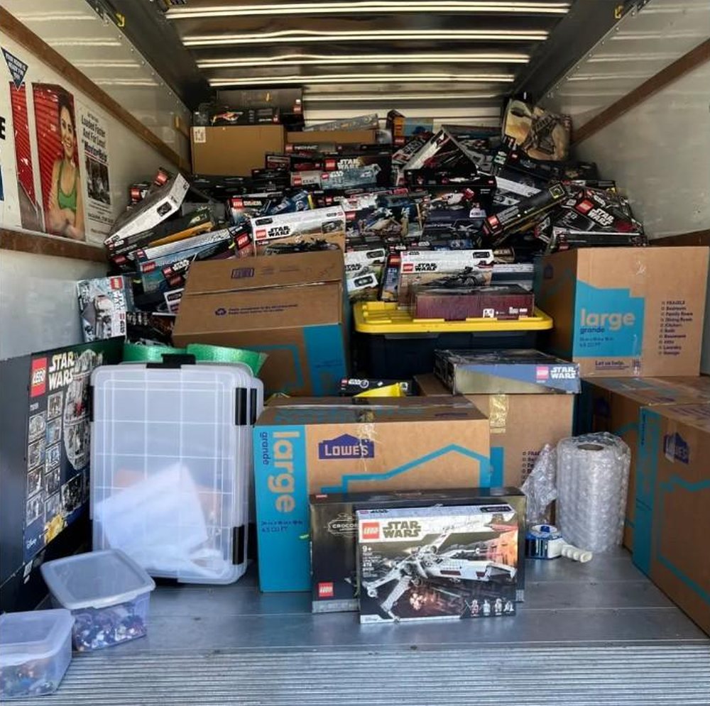 The photograph from the Clearwater store post: the inside of a rented box truck loaded with boxed LEGO Star Wars sets