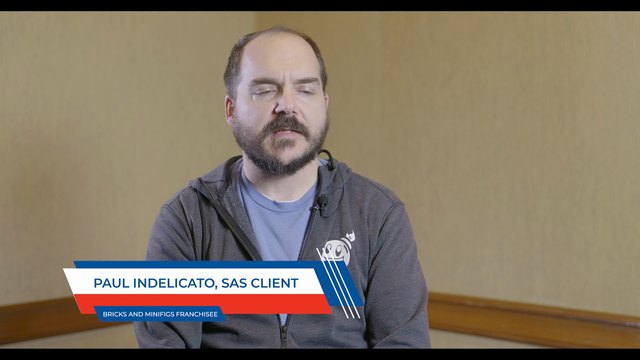Paul Indelicato, on-screen caption PAUL INDELICATO, SAS CLIENT, BRICKS AND MINIFIGS FRANCHISEE